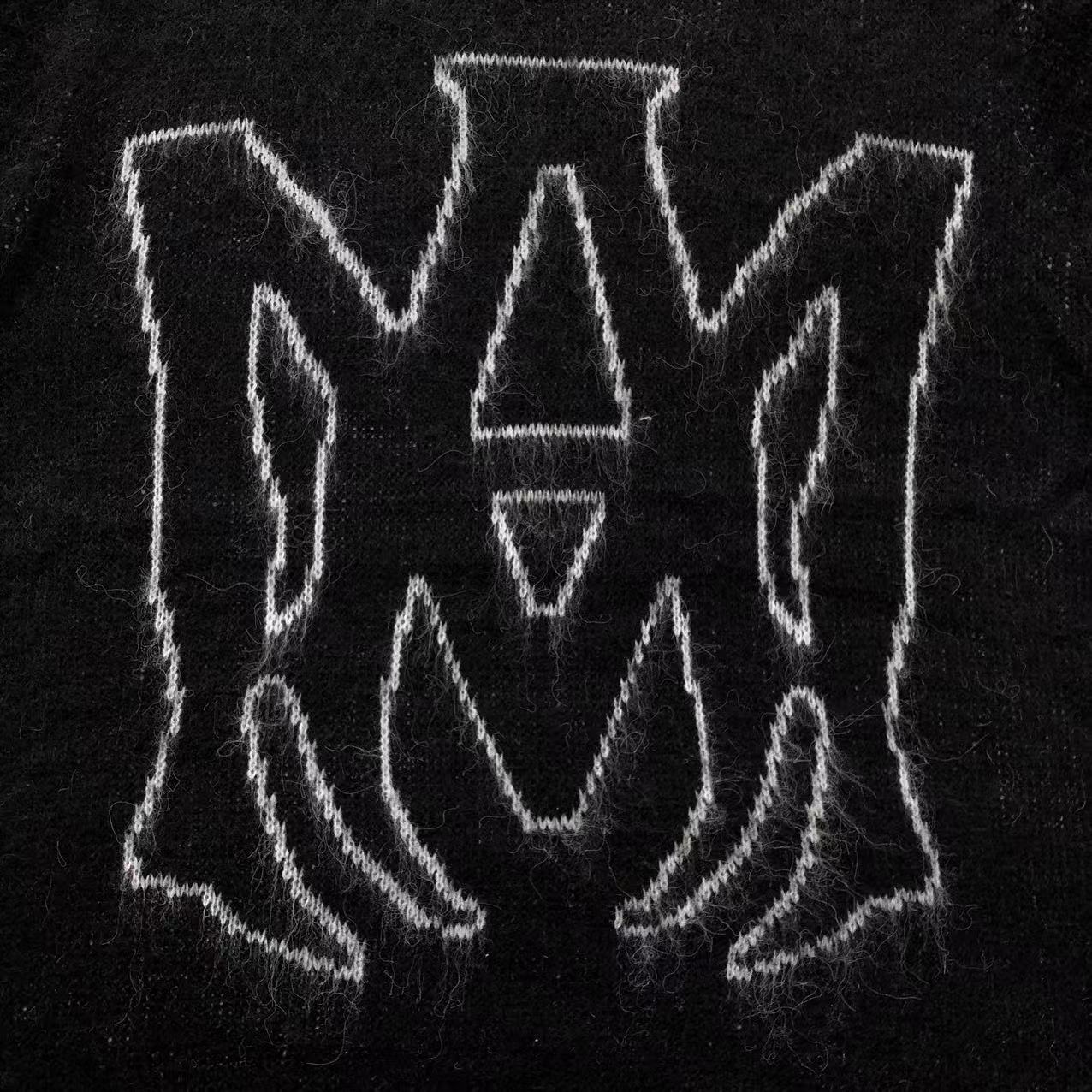 MAGLIONE AMIRI