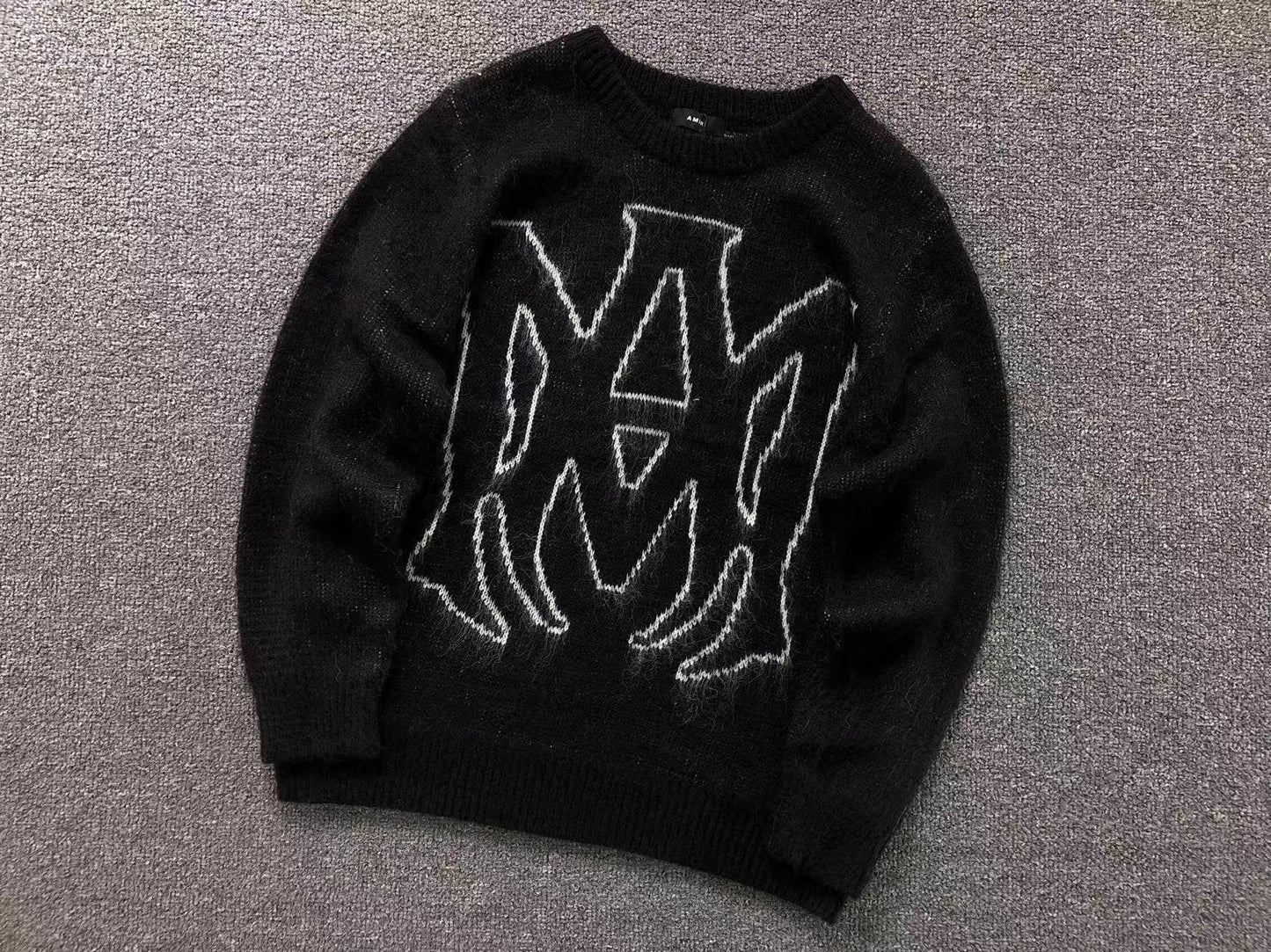MAGLIONE AMIRI
